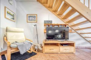 TV/trung tâm giải trí tại Ferienpark Freesenbruch Reihenhaus 7a - Otter