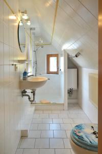 a bathroom with a sink and a toilet at Ferienpark Freesenbruch Wohnung 1 6 - Freesenblick in Zingst