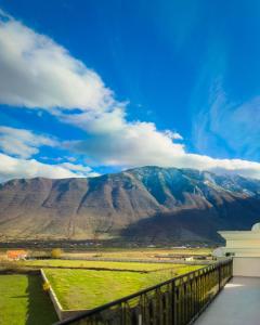 a view of a mountain range from a balcony at Leo Hotel in Kukës