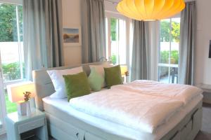 Postel nebo postele na pokoji v ubytování Logierhaus Friedrich WE 01 - "Beachhouse No 1"