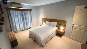 Ένα ή περισσότερα κρεβάτια σε δωμάτιο στο Hotel Parguito