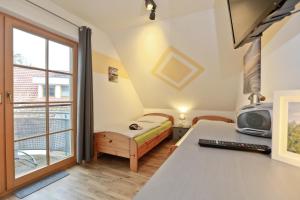 Ένα ή περισσότερα κρεβάτια σε δωμάτιο στο Ferienpark Freesenbruch Wohnung 1 4 -Ferienzeit +35 φωτογραφίες