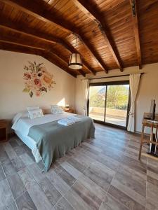Postel nebo postele na pokoji v ubytování Casa en Estancias de Cafayate A38