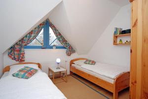 Ένα ή περισσότερα κρεβάτια σε δωμάτιο στο Ferienpark Freesenbruch Doppelhaushälfte 11 - Windflüchter +33 φωτογραφίες