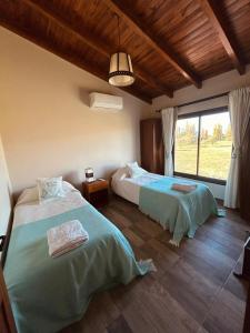 Postel nebo postele na pokoji v ubytování Casa en Estancias de Cafayate A38 + 34 fotografií