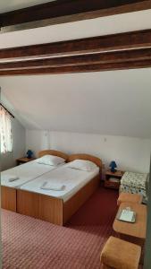Ένα ή περισσότερα κρεβάτια σε δωμάτιο στο Pension Nicoleta
