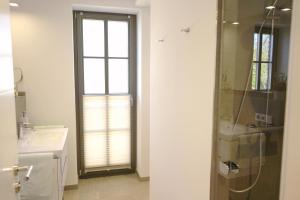 Koupelna v ubytování Strandperle - Anlage Heiderose + 19 fotografií