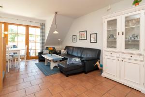 Posezení v ubytování Ferienpark Freesenbruch Wohnung 2 5 - Auszeit