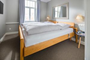 Ένα ή περισσότερα κρεβάτια σε δωμάτιο στο Kapitänshaus 1935