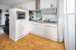 Kuchyň nebo kuchyňský kout v ubytování Sonnendeck 14 + 16 fotografií