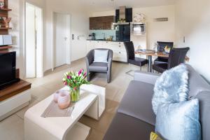 a living room with a couch and a table at SeaSide in Norderney
