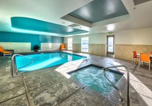 a pool in a hotel room with at Holiday Inn Express Hotel & Suites Minden by IHG in Minden