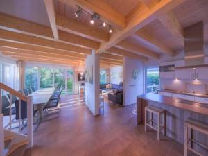 a large kitchen and living room with a table and chairs at XXL Familienferienhaus in Granzow