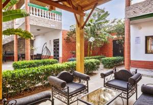 Zahrada ubytování Tekrour- la case des hotes - Chambre individuelle avec piscine et terrasse