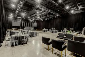 a large room with tables and chairs in it at Marriott Hotel Buenos Aires Ezeiza Airport in Ezeiza +45 photos