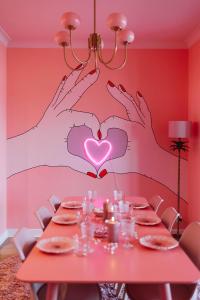 a table with a heart painted on the wall at The Rozette Experience in Ostend