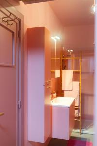 a bathroom with a sink and a mirror at The Rozette Experience in Ostend +14 photos