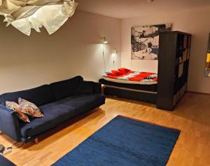 a living room with a couch and a bed at Spacious Apartment in Kallio in Helsinki