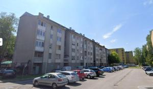 a row of cars parked in front of a building at Apartman BRKO in Bihać