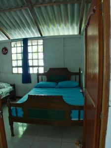 Postel nebo postele na pokoji v ubytování Coco Encantado Eco Hostal Camping