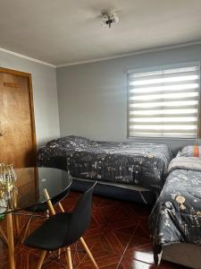 Giường trong phòng chung tại Hostal Verde Bendito Apartmento 1 Temuco