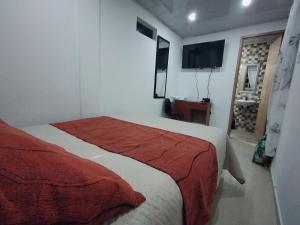 Postel nebo postele na pokoji v ubytování D habitación con baño privdo + 3 fotografie