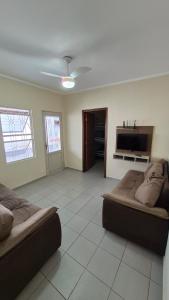 a living room with two beds and a fireplace at Residencial Ana Jacinta in Campinas +26 photos