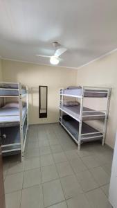 two bunk beds in a room with a ceiling at Residencial Ana Jacinta in Campinas