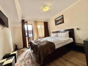 Postel nebo postele na pokoji v ubytování Casa Adrian