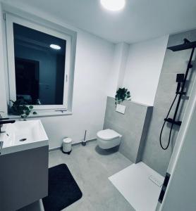 Koupelna v ubytování Appartment Herford + 2 fotografie