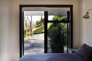 Ένα ή περισσότερα κρεβάτια σε δωμάτιο στο Minden Retreat +8 φωτογραφίες