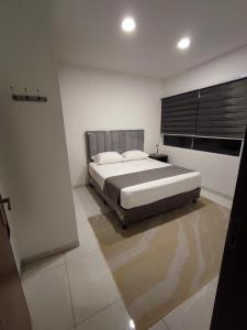 Ένα ή περισσότερα κρεβάτια σε δωμάτιο στο Arena Cielo y mar