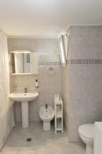 a bathroom with a sink and a toilet at Santa Marina 9 In the center of Ioannina! in Ioannina