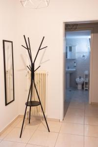 a black sculpture in a room with a bathroom at Santa Marina 9 In the center of Ioannina! in Ioannina