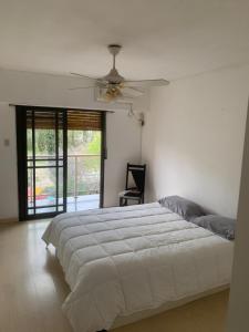 Ένα ή περισσότερα κρεβάτια σε δωμάτιο στο Altos de Neuquen