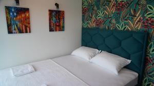 Postel nebo postele na pokoji v ubytování River House Sunrise + 14 fotografií