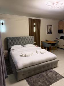 Postel nebo postele na pokoji v ubytování Golden Sky Residence