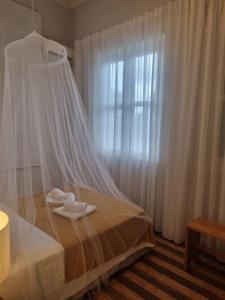 Postel nebo postele na pokoji v ubytování Chalé Quitxiba