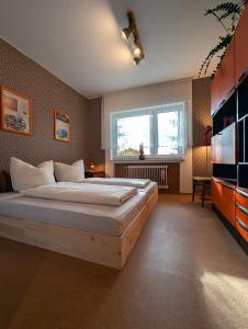 Ένα ή περισσότερα κρεβάτια σε δωμάτιο στο PRIMA Quartier