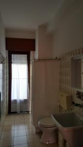 a bathroom with a tub and a toilet and a sink at Tra L'Etna e il Mare in Giarre +2 photos