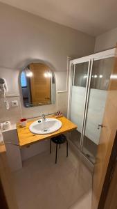 a bathroom with a sink and a shower at Apartamentos La Solana in Potes +81 photos