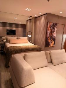 Postel nebo postele na pokoji v ubytování Seu Refúgio de Luxo a Passos do Mar em Itapema