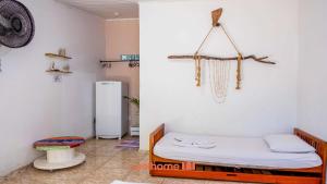 Ένα ή περισσότερα κρεβάτια σε δωμάτιο στο Pouso da Pardoca