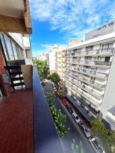 a view from a balcony of a building with a street at Del Paseo al Mar in Mar del Plata +4 photos