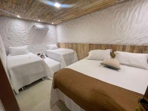 Postel nebo postele na pokoji v ubytování Villa da Praia -Orla de Atalaia