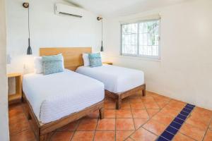 Ένα ή περισσότερα κρεβάτια σε δωμάτιο στο Estudio Surf 2 Harborfront Studio in Punta Mita