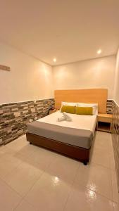 Ένα ή περισσότερα κρεβάτια σε δωμάτιο στο Hotel MOVA