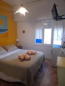 Ένα ή περισσότερα κρεβάτια σε δωμάτιο στο La Vecindad del Sol Depto H