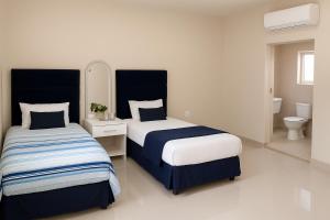 Ένα ή περισσότερα κρεβάτια σε δωμάτιο στο Bear Haven Lodge