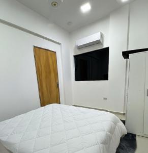 En eller flere senge i et værelse på MODERNO APARTAMENTO COMPLETO EN EXCELENTE UBICACIÓN c